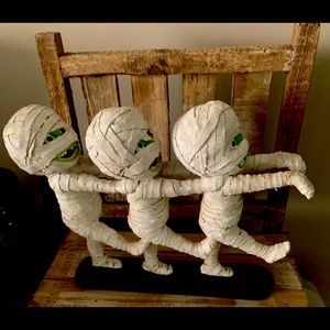Cute mummy trio statue